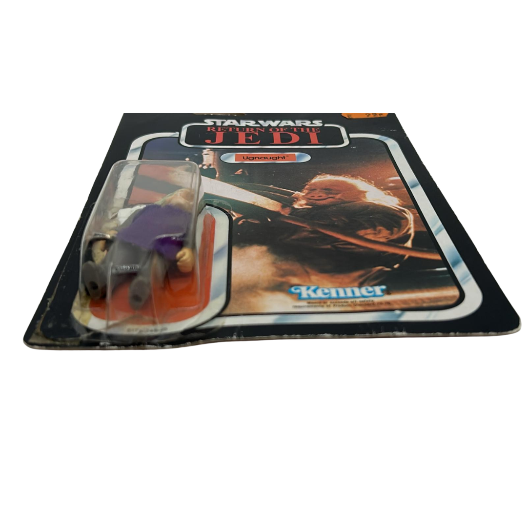 Vintage Star Wars Ugnaught figure on opened card ROTJ cardback & clear bubble