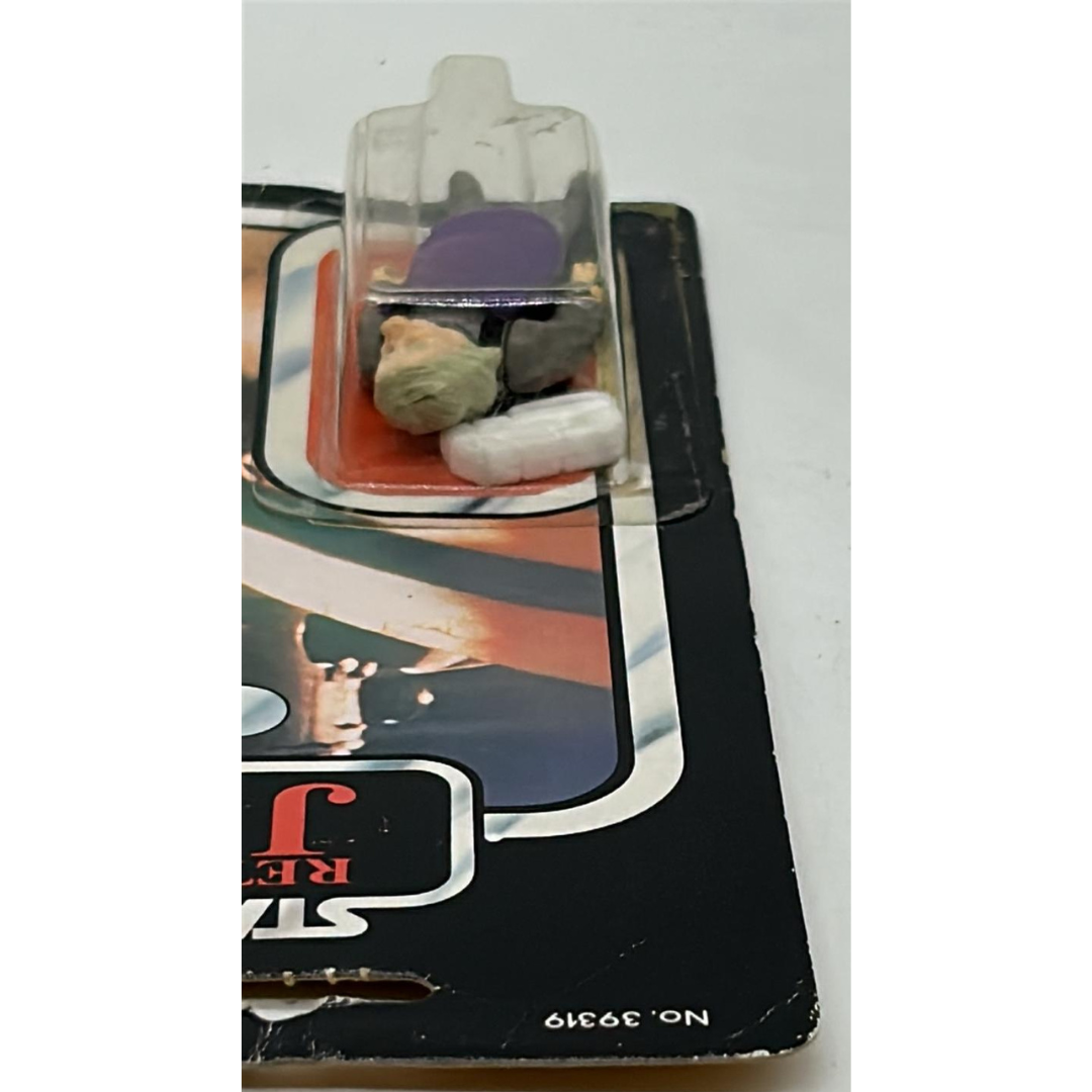 Vintage Star Wars Ugnaught figure on opened card ROTJ cardback & clear bubble