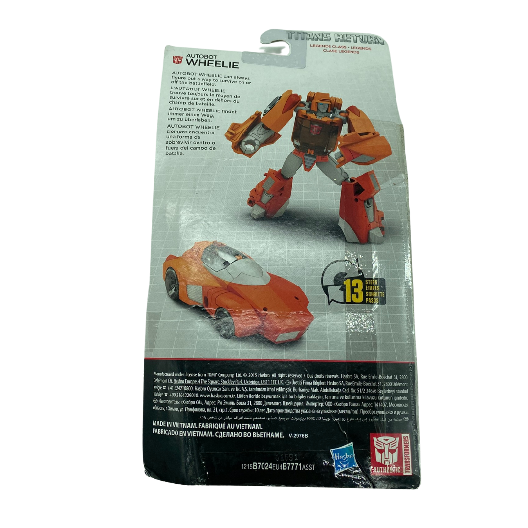 Transformers Titans Return Wheelie in opened packaging